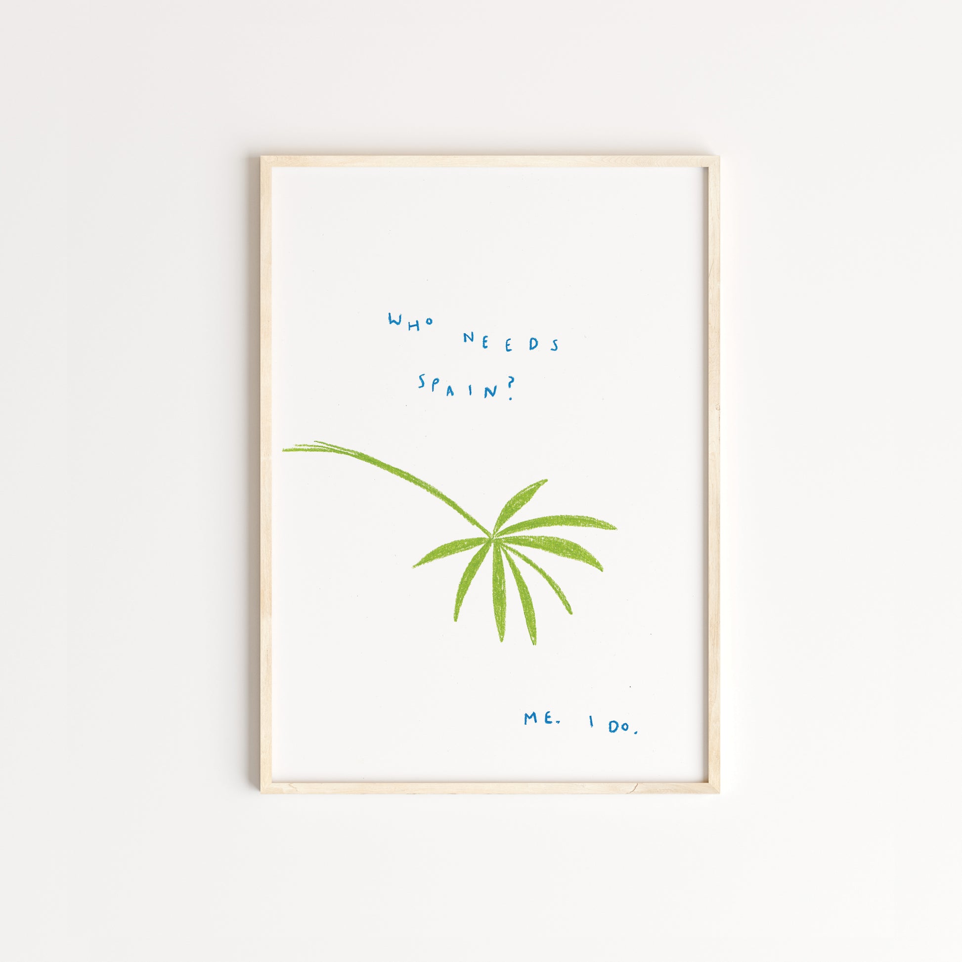 An illustrated piece of a green palm tree with the words 'who needs spain? me. i do' written in blue pastel pencil. Displayed in an oak frame.