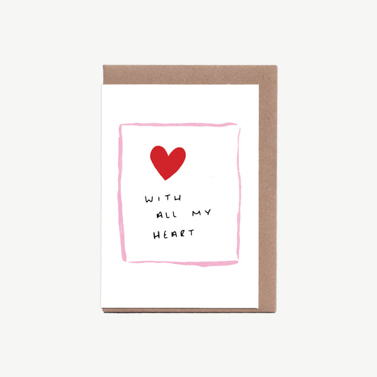 Greetings card with the words all my heart written in black pen, surrounded by a red love heart and a thin pink border in gouache paint