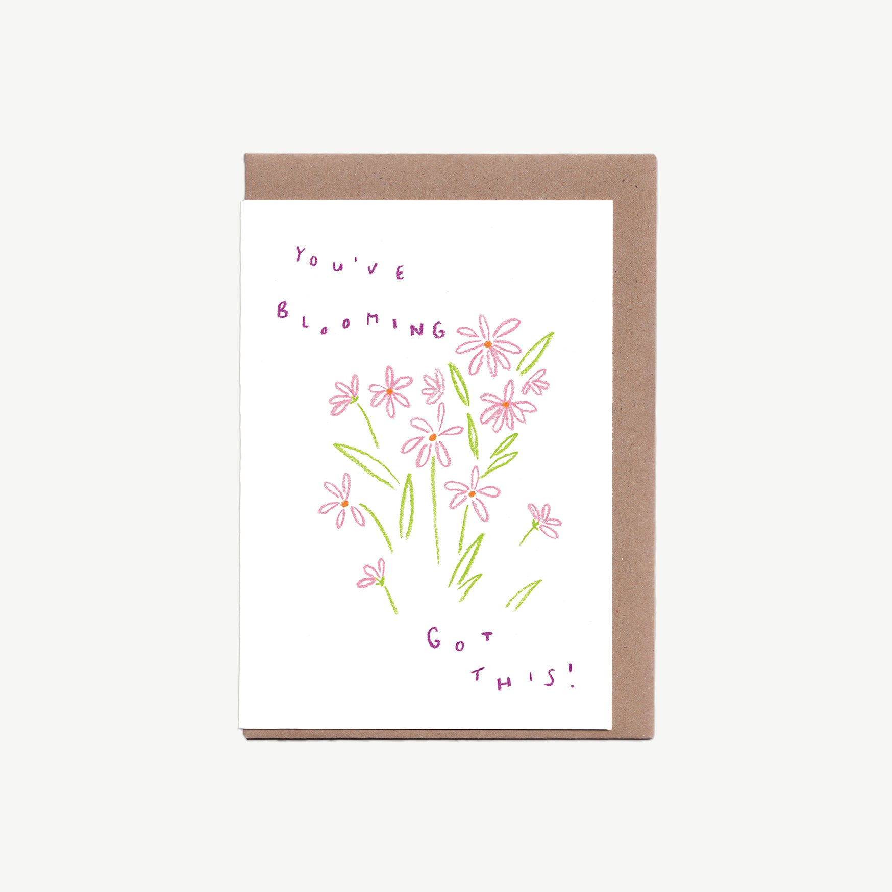 A Greetings Card with pink flowers and the words 'You've blooming got this' written in purple, drawn with pastel pencils